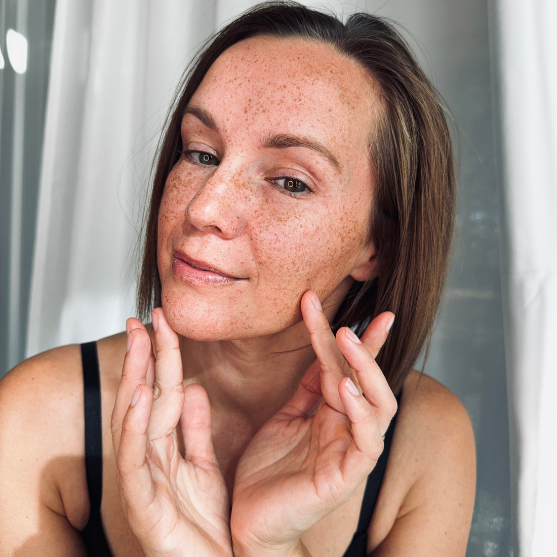 woman applying Anti-Aging Facial Cream – Tallow-Based Hydration, Firmness & Radiance
