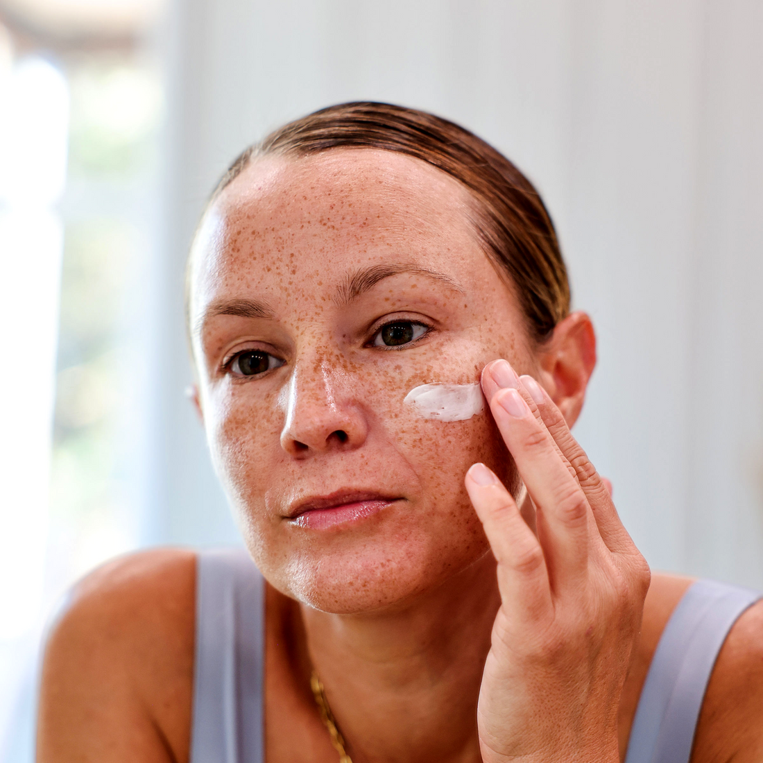 woman applying Anti-Aging Facial Cream – Tallow-Based Hydration, Firmness & Radiance
