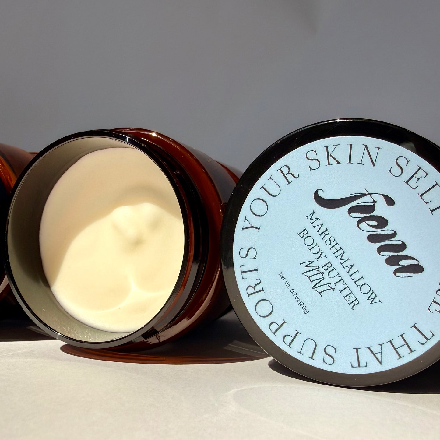 Marshmallow body butter in mini size with lid open